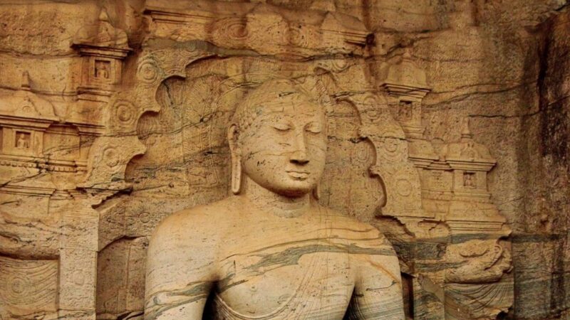 Exploring sri lankas incredible temples - a buddha carved into rocks