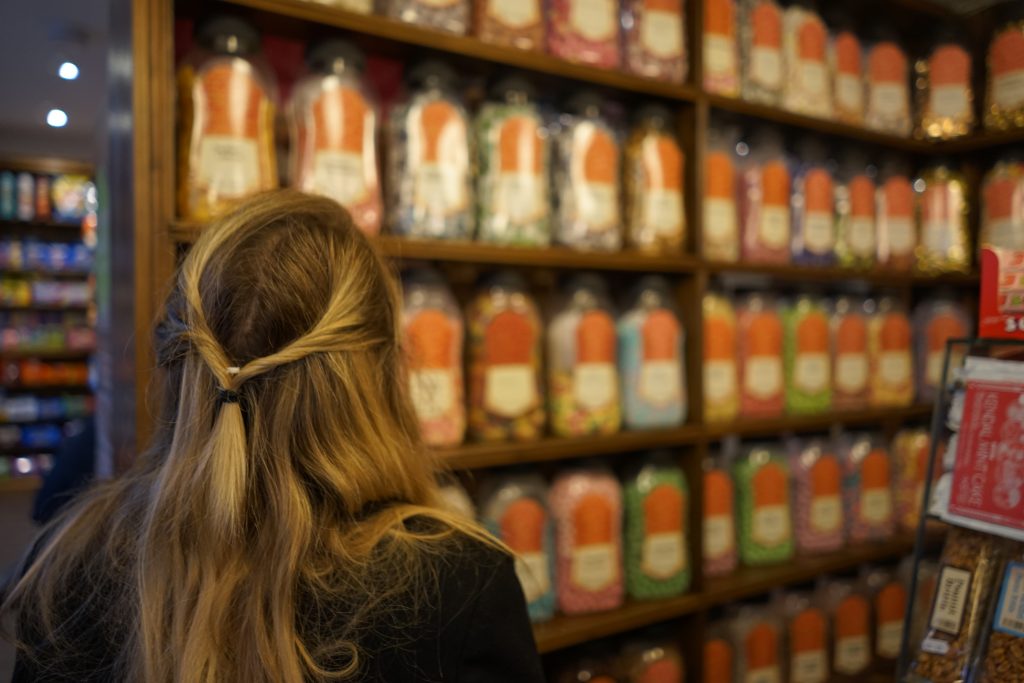 Gazing at jars of sweets in an old fashioned sweet shop in Haworth town centre