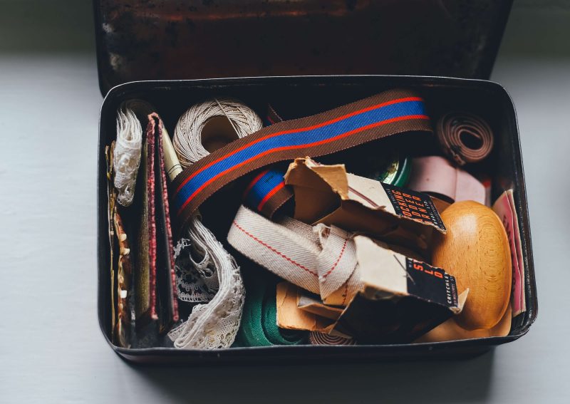 a sailboat storage canvas box full of sewing materials