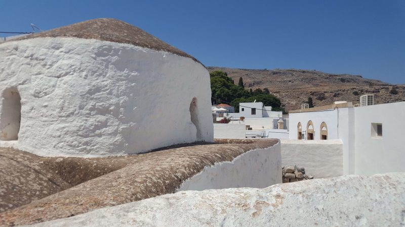 white washed stone houses in paros