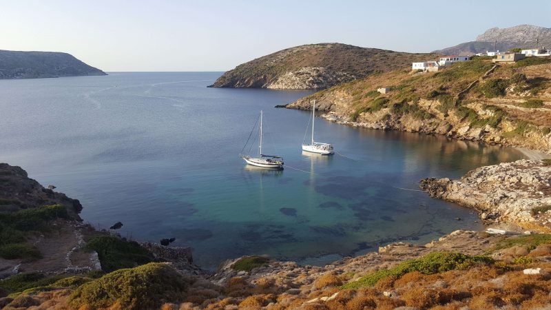 two sailboats in an anchorage in greece