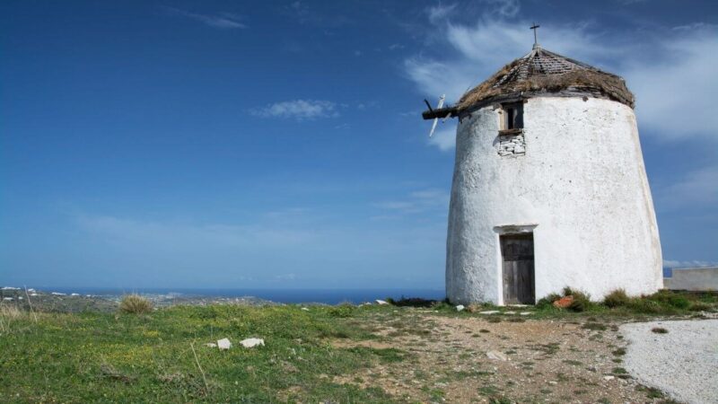 a windmill in lefkes on paros island, greece