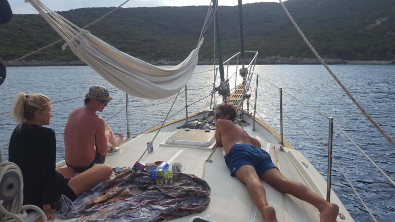friends on the deck of a sailboat