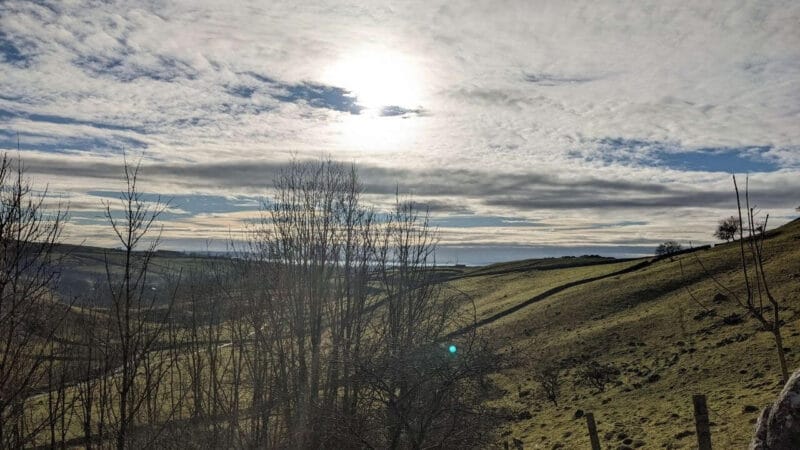 malham cove views with trees in foreground