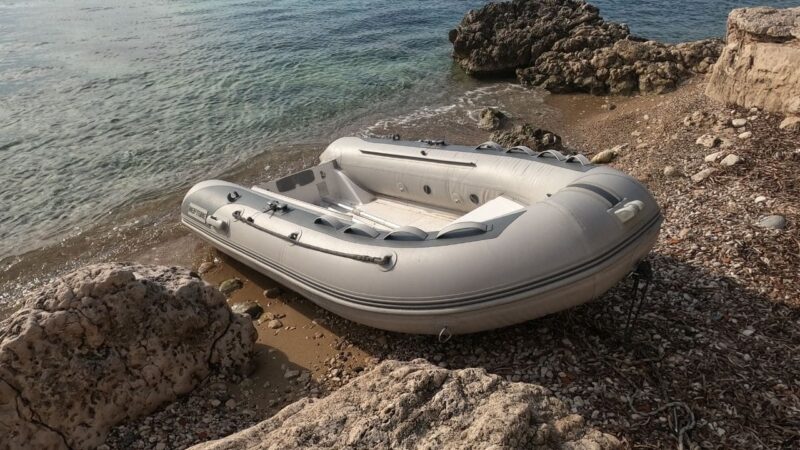 a dinghy washed up on a beach