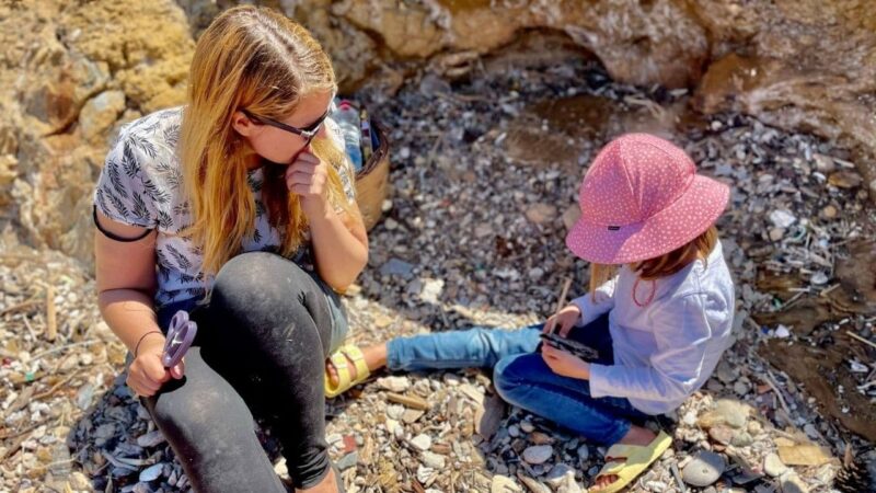 a woman teaching a child in a liveaboard marina