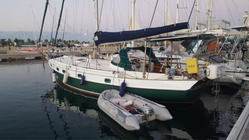 a sailboat docked in a liveaboard marina