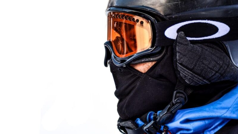 a man wearing ski goggles on a ski trip