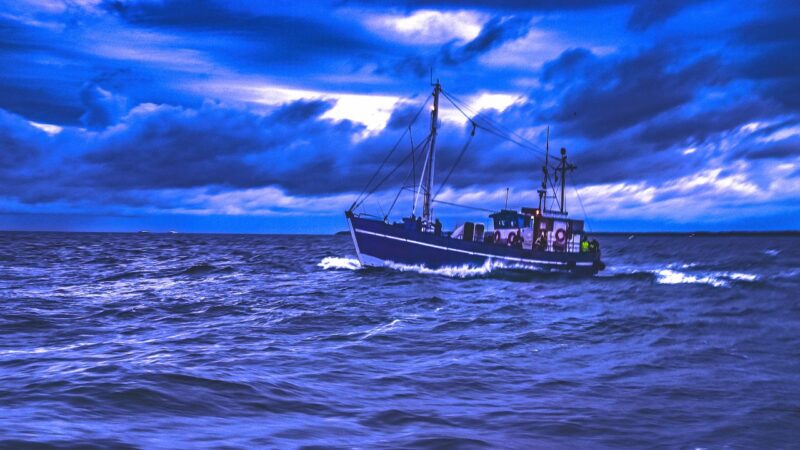 a fishing vessel in rough seas