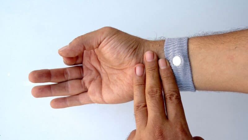 a man wearing seasickness bands