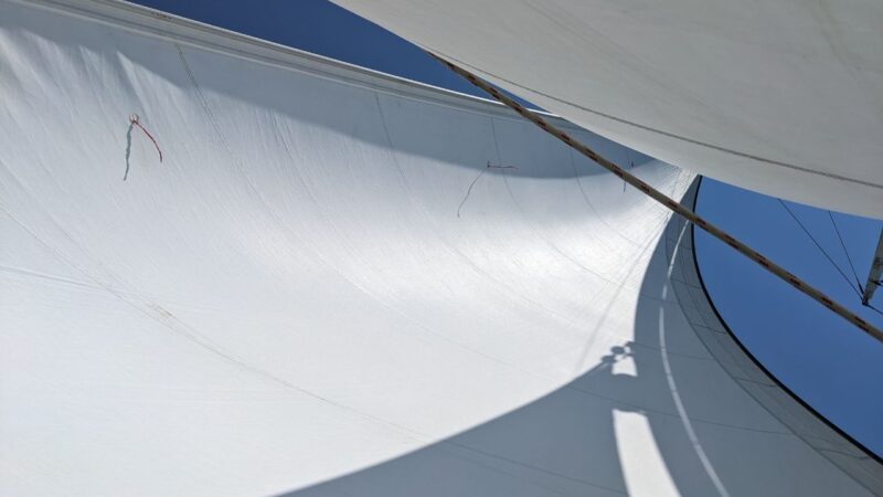 the sails of a sailboat