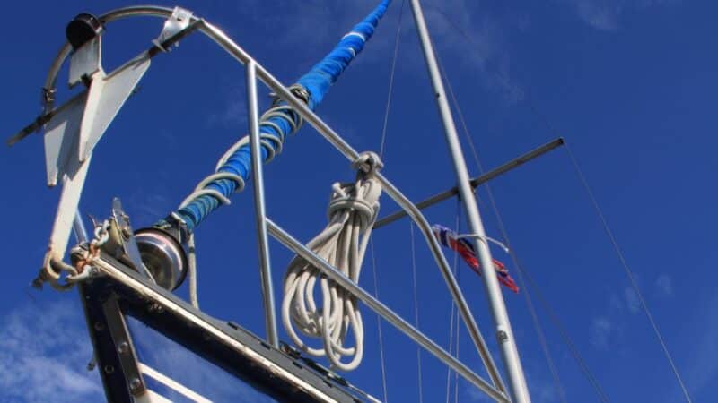 a danforth anchor on the bow of a sailboat