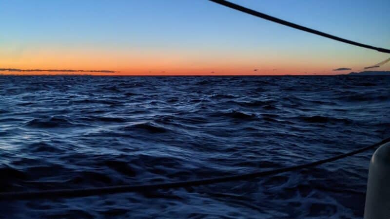 night time at sea on a sailboat