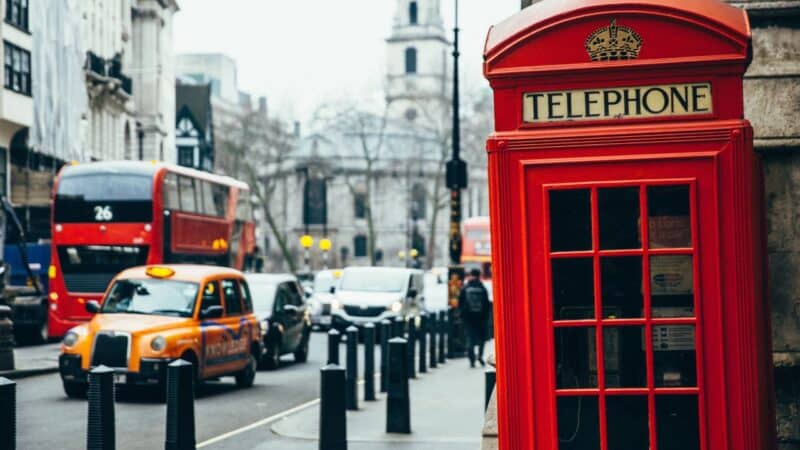 a red telephone box in the city of london