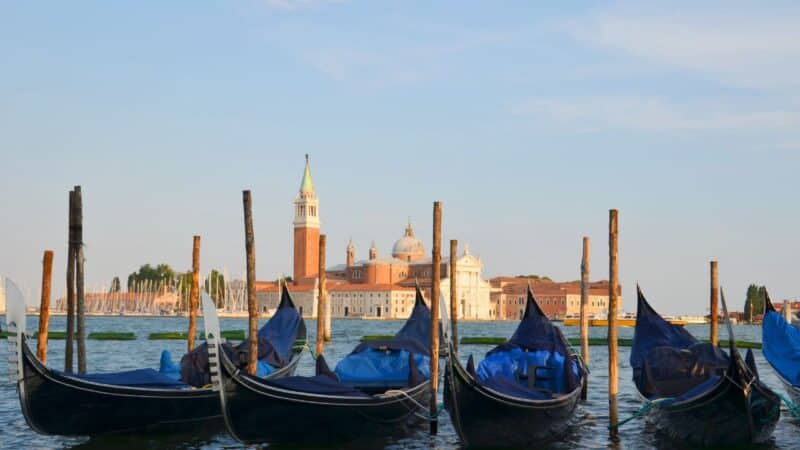 gondolas line up in venice in north italy