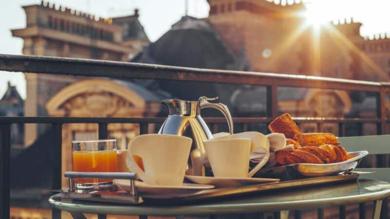 breakfast on a balcony at one of the best hidden gem hotels in paris
