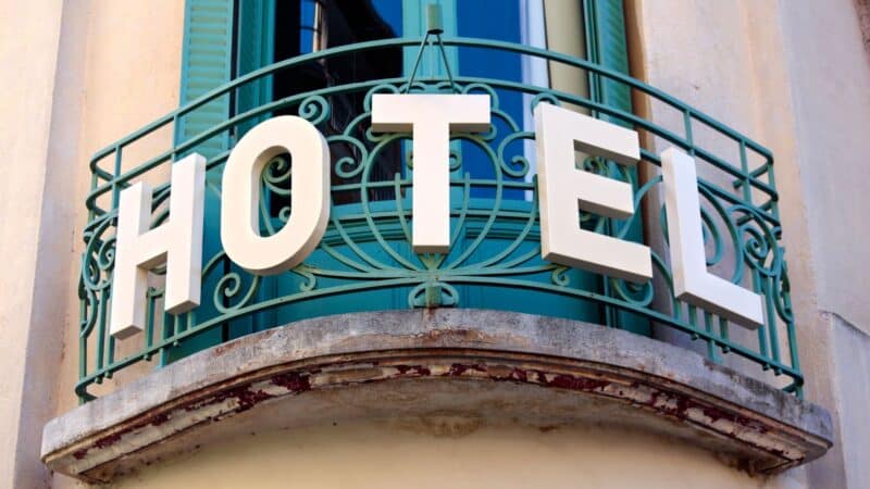 a big hotel sign on a paris balcony