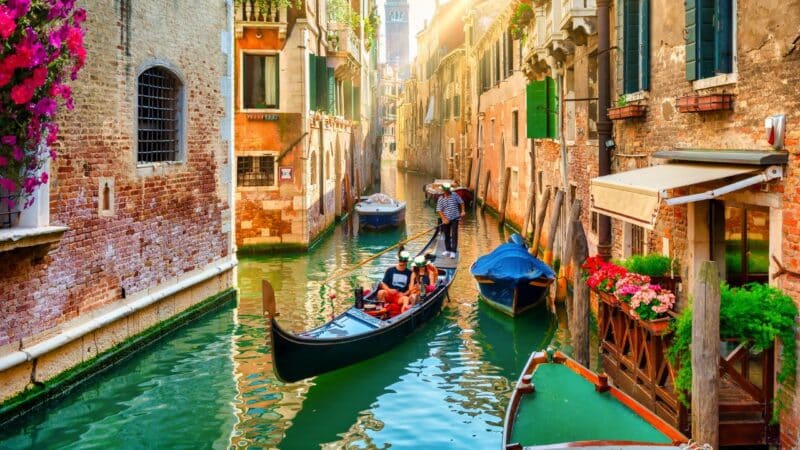 a couple on a romantic gondola ride in venice