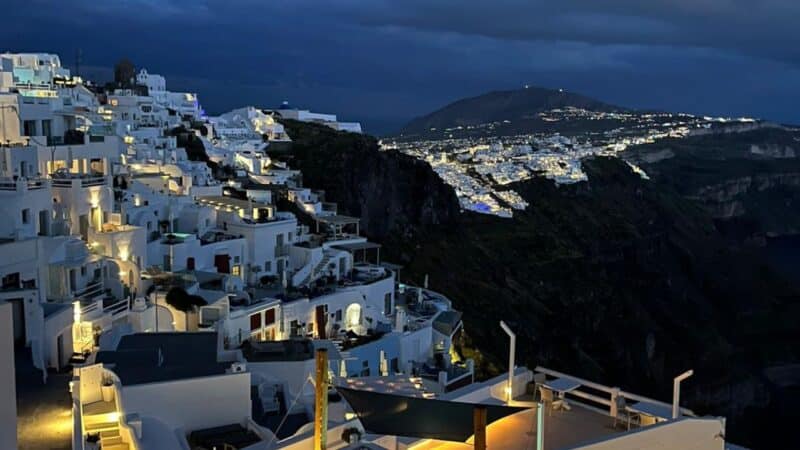 santorini at night with all the houses and hotels lit up
