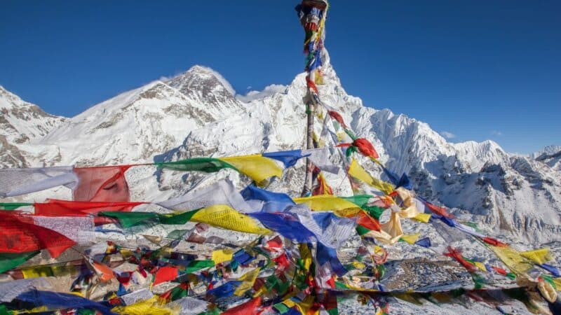 Nepalese prayer flags on top of mount everest