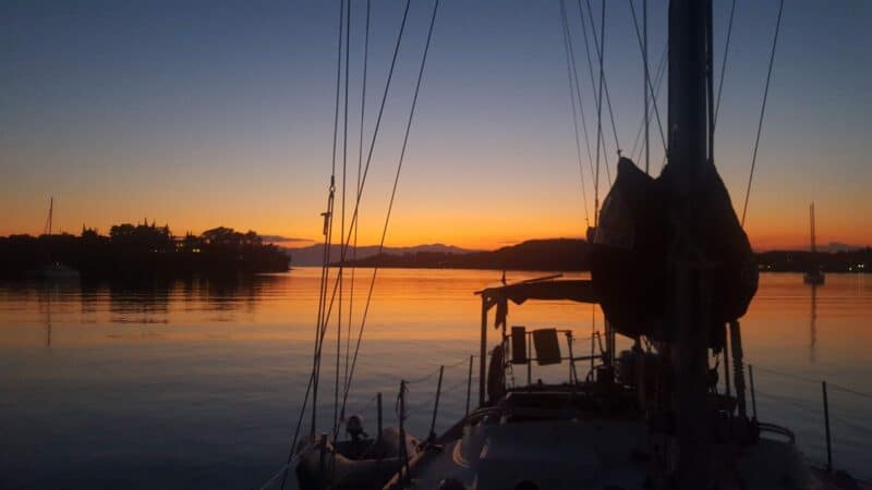 a sailboat at sunset