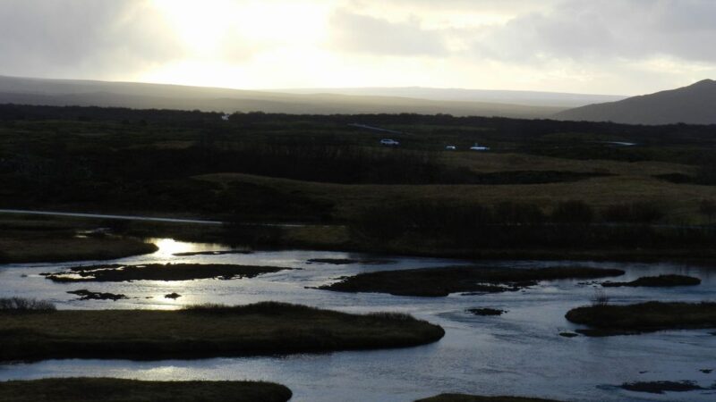 the sun setting over some lakes in iceland
