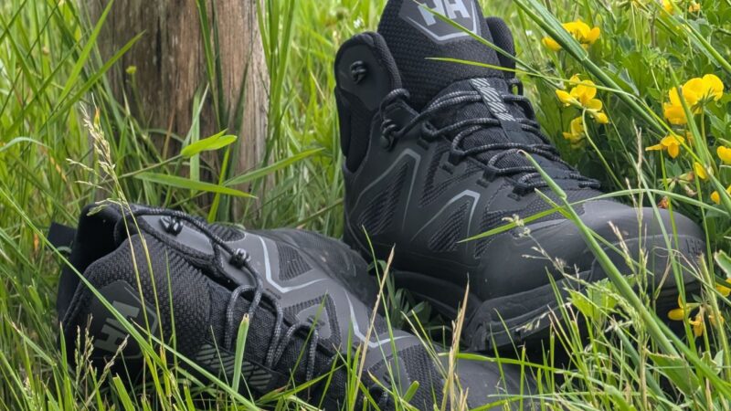 Helly Hansen Cascade boots lying in a grassy field