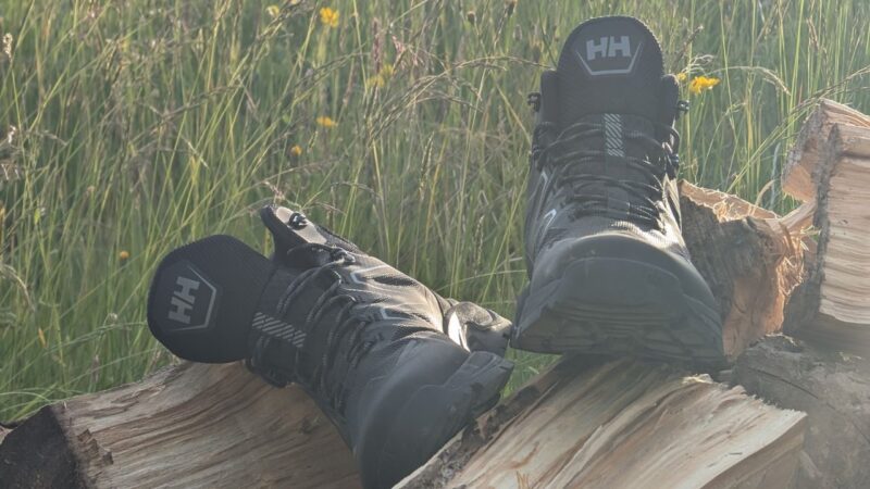 some hiking boots lying on some logs